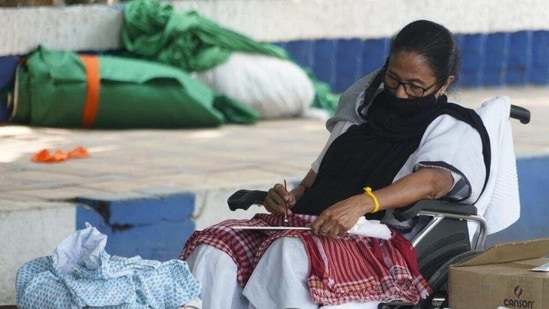 West Bengal chief minister Mamata Banerjee sits on a dharna at Gandhi Murti in Kolkata on Tuesday, April 13, 2021. (HT Photo)