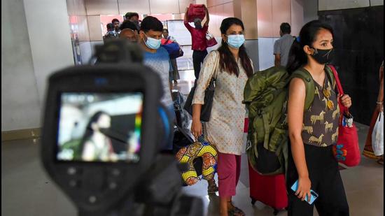 File photo: Passengers undergo digital scanning to check body temperature in view of Covid-19. (PTI) File photo: Passengers undergo digital scanning to check body temperature in view of Covid-19. (PTI)