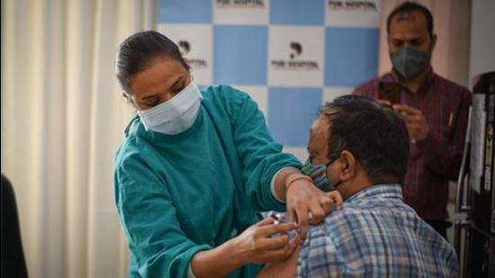 A beneficiary gets a dose of Covid-19 vaccine at PSRI Hospital in New Delhi on April 6. (HT file photo) A beneficiary gets a dose of Covid-19 vaccine at PSRI Hospital in New Delhi on April 6. (HT file photo)
