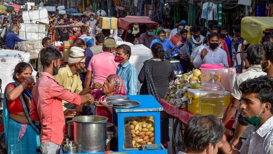 A crowd at Sadar Bazar, with many people not wearing face masks, amid a spike in coronavirus cases in New Delhi on April 13. The city has in the past three days added 35,733 fresh cases — more than February and March combined, when it added 27,334 cases, highlighting the rate at which cases have spiked in the fourth wave. (Vijay Verma / PTI)