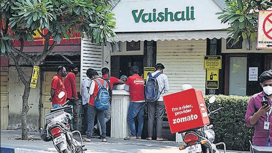 Food delivery men stand outside Hotel Vaishali to collect their orders on Sunday. (FILE PHOTO) Food delivery men stand outside Hotel Vaishali to collect their orders on Sunday. (FILE PHOTO)