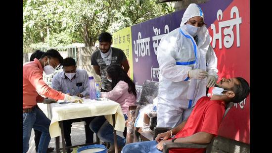A resident getting tested for Covid during a camp organised by the health department in Ludhiana on Wednesday. (Gurpreet Singh/HT)