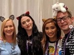 Macaulay Culkin and Brenda Song pose with Kat Dennings.
