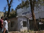 Employees enter a Wipro Ltd. office building in the Electronic City area of Bengaluru. (Bloomberg) Employees enter a Wipro Ltd. office building in the Electronic City area of Bengaluru. (Bloomberg)