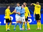 Manchester City's Phil Foden shakes hands with Dortmund's Raphael Guerreiro after the Champions League quarterfinal second leg soccer match between Borussia Dortmund and Manchester City at the Signal Iduna Park stadium in Dortmund, Germany, Wednesday, April 14, 2021. Manchester City's Phil Foden shakes hands with Dortmund's Raphael Guerreiro after the Champions League quarterfinal second leg soccer match between Borussia Dortmund and Manchester City at the Signal Iduna Park stadium in Dortmund, Germany, Wednesday, April 14, 2021.