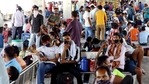 Passengers wait at the station as they arrive to board the train for their hometown amid the surge in Covid-19 cases, at Anand Vihar Railway Station in New Delhi. (ANI) Passengers wait at the station as they arrive to board the train for their hometown amid the surge in Covid-19 cases, at Anand Vihar Railway Station in New Delhi. (ANI)