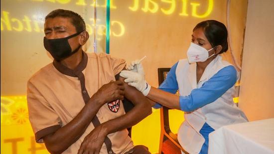 A medic administers Covid-19 vaccine to a man at Ambience Mall in Gurugram, on Sunday, April 11. (File photo)