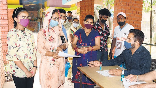 Students and their parents enquiring about admissions at Government Model Senior Secondary Smart School, Punjab Agricultural University, in Ludhiana on Thursday. (Harsimar Pal Singh/HT)