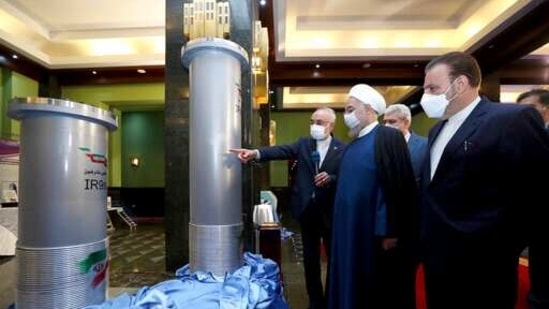 FILE - In this April 10, 2021 file photo released by the official website of the office of the Iranian Presidency, President Hassan Rouhani, second right, listens to head of the Atomic Energy Organization of Iran Ali Akbar Salehi while visiting an exhibition of Iran's new nuclear achievements in Tehran, Iran. Negotiations aimed at bringing the United States back into the landmark nuclear deal with Iran are resuming on Thursday, April 15. At issue is how to revive a 2015 deal between Iran and world powers that was intended to set limits on Tehran’s nuclear program in order to make it impossible for it to build a nuclear weapon. (Iranian Presidency Office via AP, File)(AP) FILE - In this April 10, 2021 file photo released by the official website of the office of the Iranian Presidency, President Hassan Rouhani, second right, listens to head of the Atomic Energy Organization of Iran Ali Akbar Salehi while visiting an exhibition of Iran's new nuclear achievements in Tehran, Iran. Negotiations aimed at bringing the United States back into the landmark nuclear deal with Iran are resuming on Thursday, April 15. At issue is how to revive a 2015 deal between Iran and world powers that was intended to set limits on Tehran’s nuclear program in order to make it impossible for it to build a nuclear weapon. (Iranian Presidency Office via AP, File)(AP)