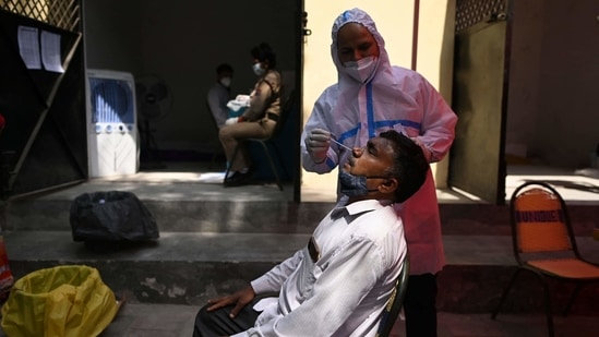 As many as 13,014 patients recovered from the disease on the day, taking the overall recoveries to 718,176.(AFP) As many as 13,014 patients recovered from the disease on the day, taking the overall recoveries to 718,176.(AFP)