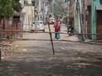 Jaipur: Bamboo poles placed as barricading to keep people inside an area declared a Covid-19 containment zone at Malviya Nagar, in Jaipur, Rajasthan, India on Wednesday, April 14, 2021. 