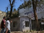 Employees enter a Wipro Ltd. office building in the Electronic City area of Bengaluru. (Bloomberg) Employees enter a Wipro Ltd. office building in the Electronic City area of Bengaluru. (Bloomberg)