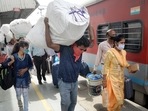 Migrants board a train to their native places in Bihar amid rise in coronavirus cases across the country. (PTI Photo ) Migrants board a train to their native places in Bihar amid rise in coronavirus cases across the country. (PTI Photo )