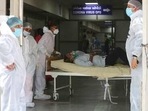 Health workers carry a patient into a dedicated Covid-19 hospital in Ahmedabad, The picture is still grim in parts of Europe and Asia as variants of the virus fuel an increase in new cases and the worldwide death toll closes in on 3 million. Health workers carry a patient into a dedicated Covid-19 hospital in Ahmedabad, The picture is still grim in parts of Europe and Asia as variants of the virus fuel an increase in new cases and the worldwide death toll closes in on 3 million.