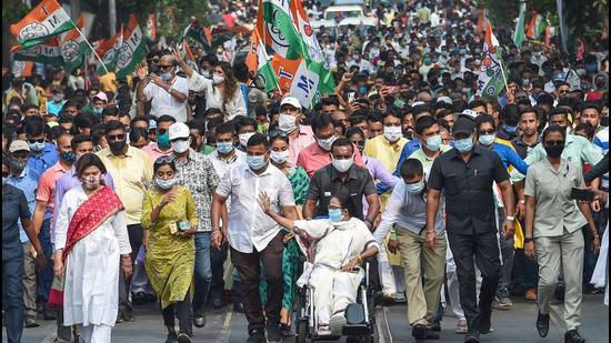 West Bengal chief minister Mamata Banerjee during a roadshow for state assembly polls, in Kolkata on Thursday, April 15. (PTI) West Bengal chief minister Mamata Banerjee during a roadshow for state assembly polls, in Kolkata on Thursday, April 15. (PTI)
