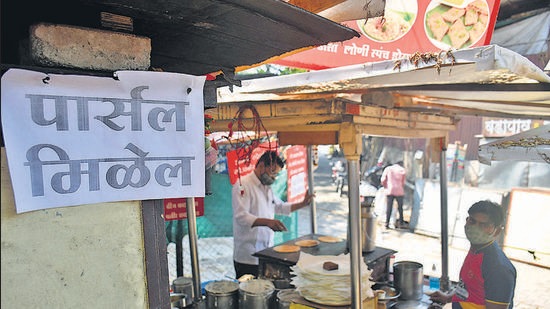 A notice mentioning parcel service facility available put up at a food stall near Shaniwarwada in Pune, on April 15. (HT PHOTO) A notice mentioning parcel service facility available put up at a food stall near Shaniwarwada in Pune, on April 15. (HT PHOTO)
