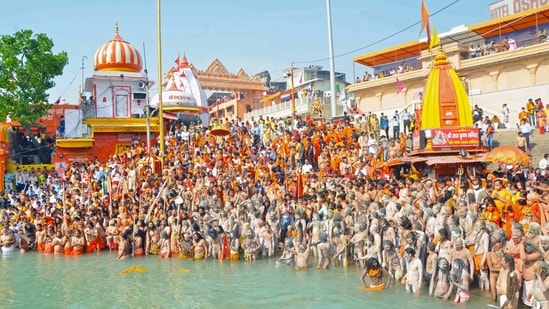 Saints of Niranjani Akhada take a holy dip at Har ki Pauri during Kumbh, in Haridwar on Wednesday. (ANI Photo)