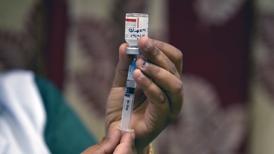 A healthcare worker fills the syringe with the COVID-19 vaccine at a Local Health Centre, in New Delhi on Thursday. (ANI Photo) A healthcare worker fills the syringe with the COVID-19 vaccine at a Local Health Centre, in New Delhi on Thursday. (ANI Photo)