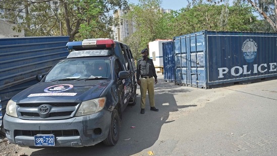 Police stand guard near the French Consulate building to beef up security following a protest by extremist political party Tehreek-e-Labbaik Pakistan (TLP), in Karachi on April 15, 2021.(AFP Photo ) Police stand guard near the French Consulate building to beef up security following a protest by extremist political party Tehreek-e-Labbaik Pakistan (TLP), in Karachi on April 15, 2021.(AFP Photo )