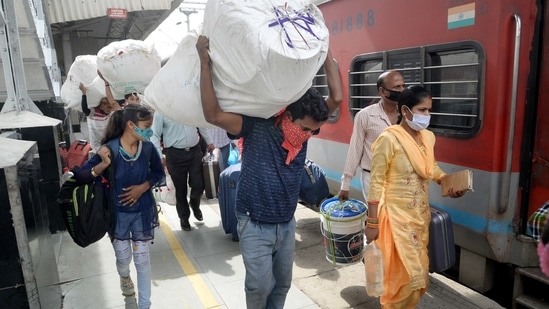Migrants board a train to their native places in Bihar amid rise in coronavirus cases across the country. (PTI Photo ) Migrants board a train to their native places in Bihar amid rise in coronavirus cases across the country. (PTI Photo )