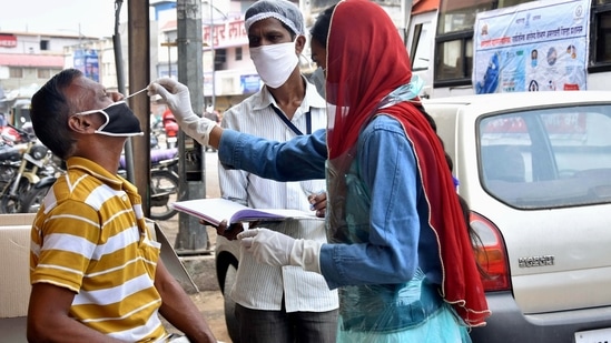 A health worker collects samples for Covid-19 testing, amid surge in coronavirus cases, in Amravati, Maharashtra, (PTI) A health worker collects samples for Covid-19 testing, amid surge in coronavirus cases, in Amravati, Maharashtra, (PTI)
