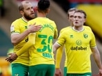 Norwich City's Teemu Pukki celebrates scoring their second goal with teammates.