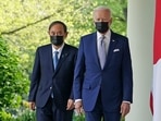 US President Joe Biden and Japan's Prime Minister Yoshihide Suga walk through the Colonnade to take part in a joint press conference in the Rose Garden of the White House in Washington. US President Joe Biden and Japan's Prime Minister Yoshihide Suga walk through the Colonnade to take part in a joint press conference in the Rose Garden of the White House in Washington.