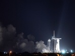 In this image released by NASA, a SpaceX Falcon 9 rocket with the company's Crew Dragon spacecraft onboard is seen on the launch pad at Launch Complex 39A during a brief static fire test ahead of NASA�s SpaceX Crew-2 mission, Saturday, April 17, 2021, at NASA�s Kennedy Space Center in Florida. - NASA�s SpaceX Crew-2 mission is the second crew rotation mission of the SpaceX Crew Dragon spacecraft and Falcon 9 rocket to the International Space Station as part of the agency�s Commercial Crew Program. NASA astronauts Shane Kimbrough and Megan McArthur, ESA (European Space Agency) astronaut Thomas Pesquet, and Japan Aerospace Exploration Agency (JAXA) astronaut Akihiko Hoshide are scheduled to launch on April 22. (Photo by Joel KOWSKY / NASA / AFP) / RESTRICTED TO EDITORIAL USE - MANDATORY CREDIT 