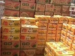 The image shows boxes filled with mangoes. The image shows boxes filled with mangoes.