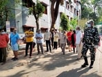 A security personnel stands guard at a polling station during the fifth phase of West Bengal assembly elections in South 24 Parganas district. (PTI Photo)