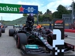 Lewis Hamilton (right) clinches pole, while Sergio Perez (left) will start second. 