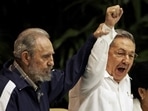 Fidel Castro raises his brother Cuba's President Raul Castro's hand as they sing the anthem of international socialism.(AP file photo) Fidel Castro raises his brother Cuba's President Raul Castro's hand as they sing the anthem of international socialism.(AP file photo)