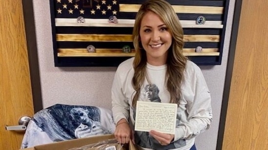 Britta Thomason, flight nurse and programme director, Air Evac Lifeteam, Dublin poses with her box of gifts and handwritten letter from US artist Taylor Swift. (via REUTERS)