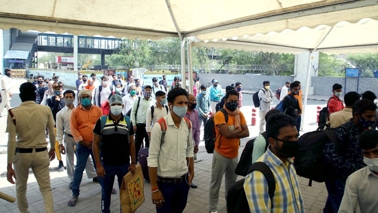 Passengers coming from various states stand in queues to get tested for COVID-19 at Anand Vihar Bus Terminal during the weekend curfew, amid a spike in coronavirus cases, in New Delhi on Saturday. (ANI Photo) Passengers coming from various states stand in queues to get tested for COVID-19 at Anand Vihar Bus Terminal during the weekend curfew, amid a spike in coronavirus cases, in New Delhi on Saturday. (ANI Photo)