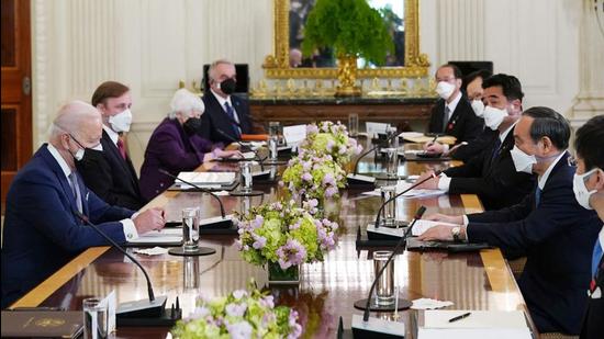 US President Joe Biden (left) and Japan’s Prime Minister Yoshihide Suga (second right) take part in an expanded meeting in the State Dining Room of the White House in Washington, DC. (AFP) US President Joe Biden (left) and Japan’s Prime Minister Yoshihide Suga (second right) take part in an expanded meeting in the State Dining Room of the White House in Washington, DC. (AFP)