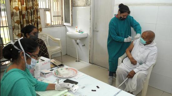 A senior citizen getting vaccinated at a health centre in Sector 38, Chandigarh. (HT Photo) A senior citizen getting vaccinated at a health centre in Sector 38, Chandigarh. (HT Photo)