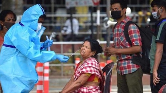 A medic collects samples for Covid-19 tests as the country continued to witness a huge surge in fresh cases on Friday. (PTI representative image) A medic collects samples for Covid-19 tests as the country continued to witness a huge surge in fresh cases on Friday. (PTI representative image)