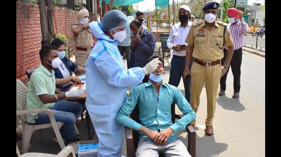 Commuters being tested for Covid-19 at a special camp outside the civil hospital in Ludhiana on Saturday. (Gurpreet Singh/HT) Commuters being tested for Covid-19 at a special camp outside the civil hospital in Ludhiana on Saturday. (Gurpreet Singh/HT)