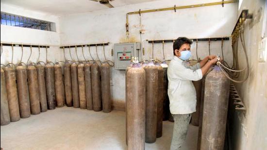 Patna: A worker checks oxygen cylinders to be used for COVID-19 patients at PMCH in Patna. (Santosh Kumar /Hindustan Times) Patna: A worker checks oxygen cylinders to be used for COVID-19 patients at PMCH in Patna. (Santosh Kumar /Hindustan Times)