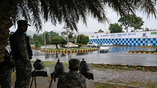 Paramilitary soldiers stand guard in front of the French Embassy in the Red Zone which was secured with shipping containers by the authorities to beef up security following violent anti-France protests, in Islamabad. (AFP) Paramilitary soldiers stand guard in front of the French Embassy in the Red Zone which was secured with shipping containers by the authorities to beef up security following violent anti-France protests, in Islamabad. (AFP)