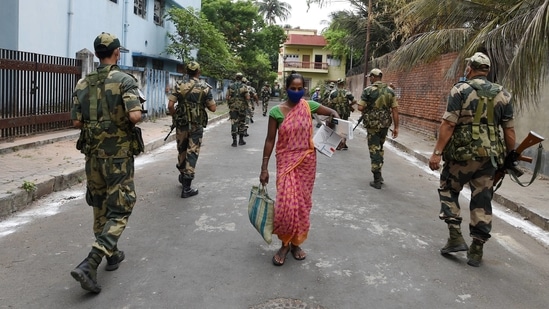 Security personnel conduct patrolling ahead of the 5th phase of West Bengal Assembly elections at Bidhannagar in Kolkata.(PTI)