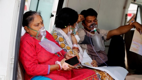 Patients wait in an ambulance in Ahmedabad on Saturday. (PTI) Patients wait in an ambulance in Ahmedabad on Saturday. (PTI)