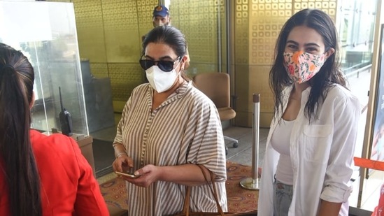 Sara and mother Amrita got clicked by the paparazzi as they waited to get their documents checked.  (Varinder Chawla)