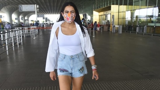 The Love Aaj Kal actor had her straight black hair flowing down her back, stacks of bands on her left wrist and a floral mask to keep herself safe amid rising Covid cases in the city.(Varinder Chawla)