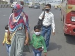 Migrant workers wait for buses at Delhi Meerut Expressway, near Indirapuram, in Ghaziabad. Migrant workers wait for buses at Delhi Meerut Expressway, near Indirapuram, in Ghaziabad.