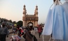 Masks hang for sale in front of Charminar in Hyderabad. (AP Photo ) Masks hang for sale in front of Charminar in Hyderabad. (AP Photo )