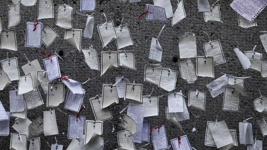Messages written by loved ones and dedicated to the deceased hang from a wall at a memorial for Covid-19 victims installed outside the Basilica of Guadalupe in Mexico City on April 14. The number of lives lost, as compiled by Johns Hopkins University, is about equal to the population of Kyiv, Ukraine; Caracas, Venezuela; or metropolitan Lisbon, Portugal. (Eduardo Verdugo / AP)