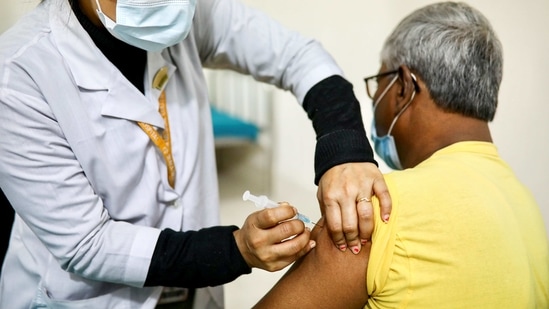 A nurse injects Oxford-AstraZeneca’s Covishield to an elderly man at the Dhaka Medical College vaccination centre in Dhaka, Bangladesh.(Reuters)