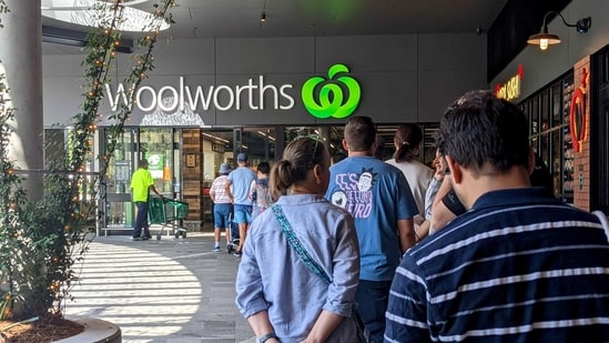 Shoppers line up outside a Woolworths store in Brisbane, Australia. (REUTERS )