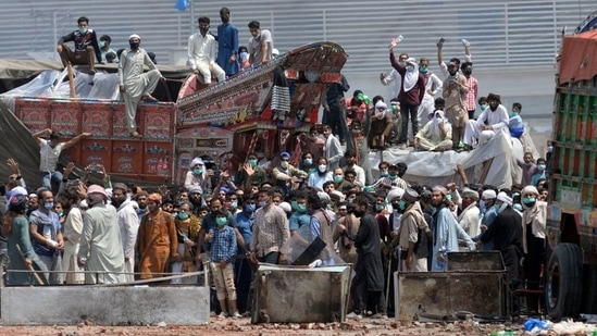 Supporters of the banned Islamist political party Tehrik-e-Labaik Pakistan (TLP) block a road during a protest in Lahore, Pakistan. (Reuters)